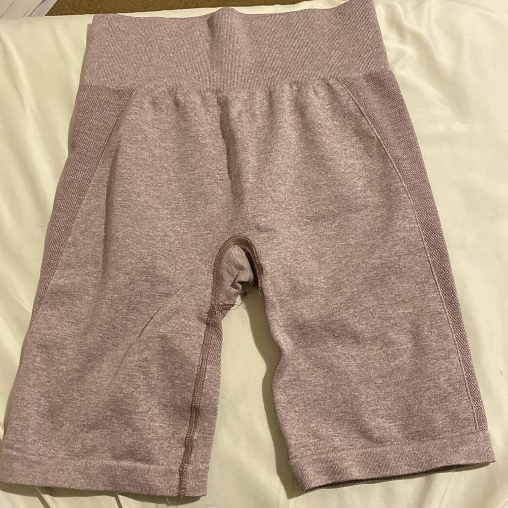 Pink Gymshark shorts.